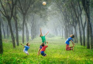 kids practice intuitive embodiment by playing in the forest